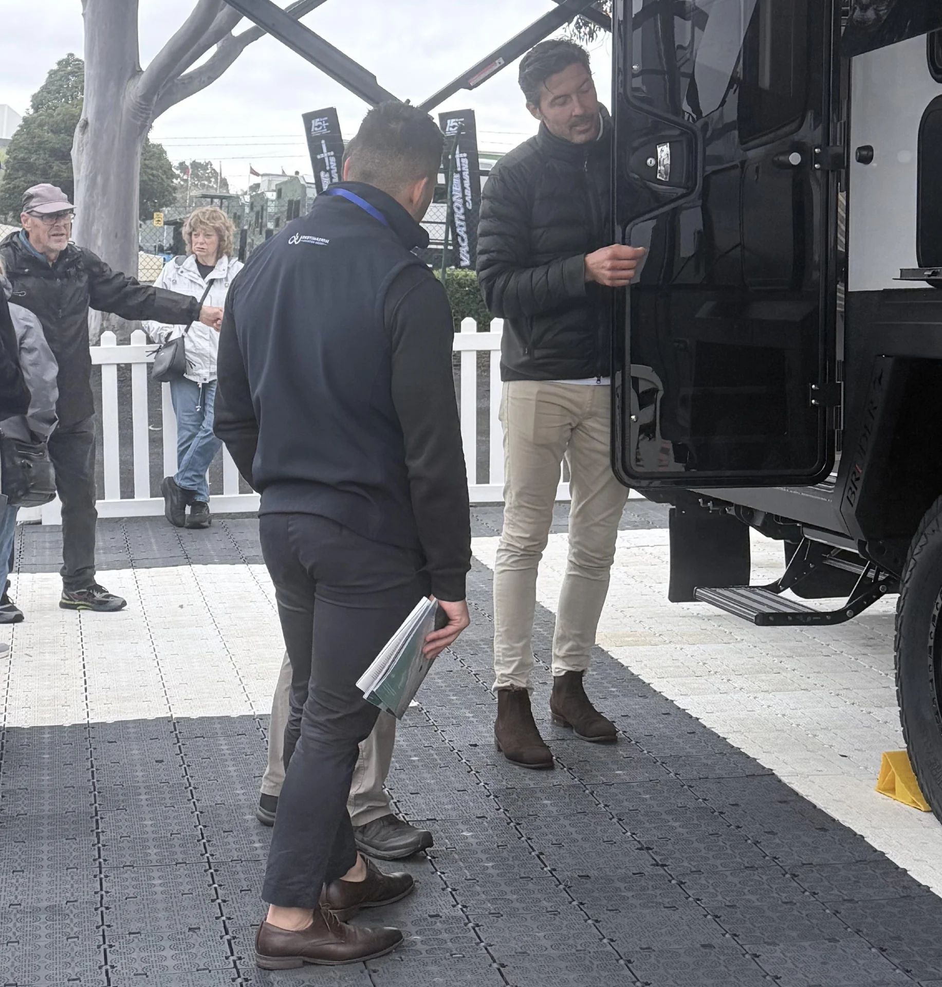 Bruder team showing visitors through the ADX-18 at the Melbourne Caravan & Camping Leisurefest, Sandown